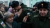 Russian conscripts called up for military service say goodbye to relatives at a railway station in Omsk in November 2022. 