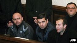 Former Defense Minister Irakli Okruashvili (second from left) sits in a Tbilisi court on December 10.